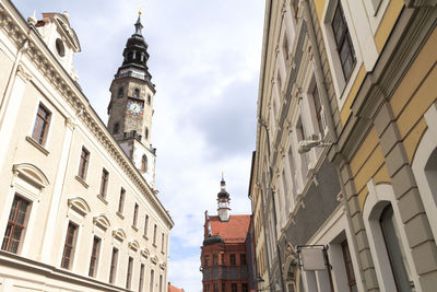 Low angle view of bell tower against sky