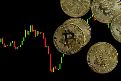 Close-up of coins on black background