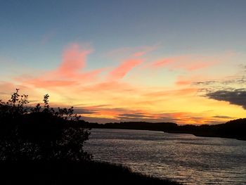 Scenic view of sea against orange sky