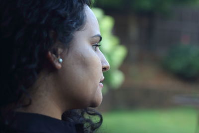 Portrait of a young woman looking away