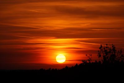 Scenic view of silhouette landscape against romantic sky at sunset