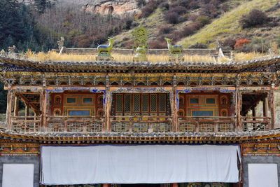 1019 woodcarved polychrome loggia-first floor shengguo temple. mati si-temple-zhangye-gansu-china.