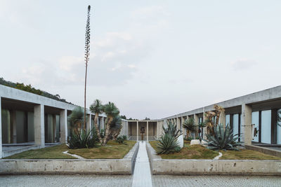 Street amidst buildings against sky