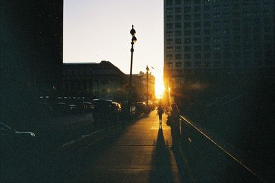 Street light against sky at sunset
