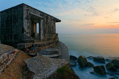 Scenic view of sea against sky at sunset