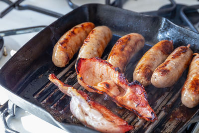 High angle view of meat on barbecue grill