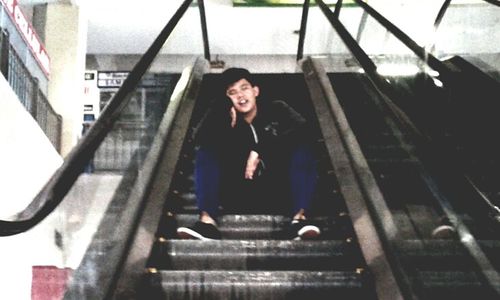 Portrait of smiling man on steps