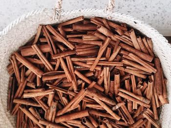 High angle view of firewood in container