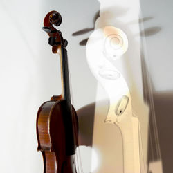 Close-up of violin against wall