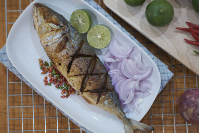 High angle view of fish served in plate on table