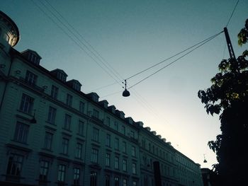 Low angle view of power lines against sky