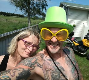 Portrait of smiling young woman wearing sunglasses