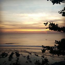 Scenic view of sea against sky at sunset