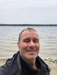 Portrait of smiling man in sea