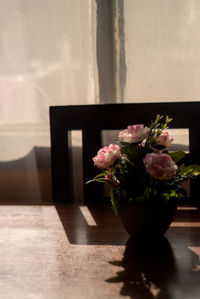 Table with sunset light along with flower arrangement