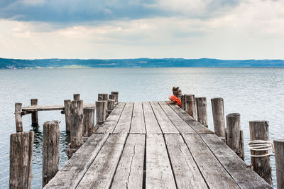 Pier over sea against sky