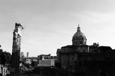 Buildings in city against sky