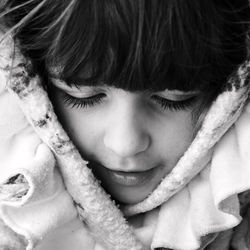 Close-up portrait of cute girl with eyes closed