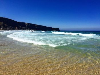 Scenic view of sea against clear sky