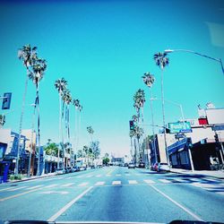 Road against clear blue sky