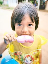 Portrait of cute girl eating food