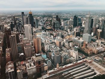 High angle view of city buildings against sky