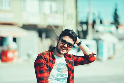 Portrait of young man standing outdoors