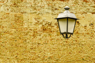 Low angle view of lamp on wall