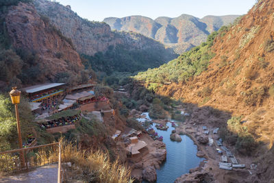 Panoramic view of river amidst buildings and mountains