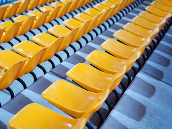 Row of yellow bleachers in stadium
