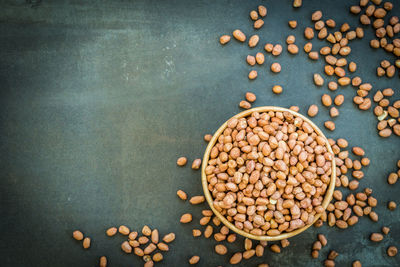 High angle view of peanuts in bowl on table