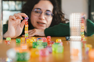 Portrait of woman with christmas decorations on table