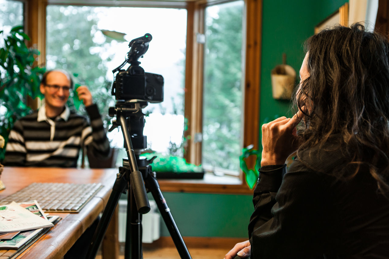 PORTRAIT OF A YOUNG WOMAN PHOTOGRAPHING