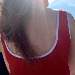 Close-up of woman standing on wall