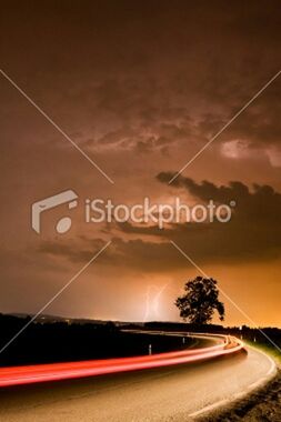 transportation, illuminated, long exposure, text, sky, speed, communication, motion, blurred motion, western script, road, light trail, night, cloud - sky, highway, on the move, dusk, red, travel, capital letter