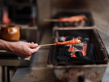 Cropped hand of person preparing food