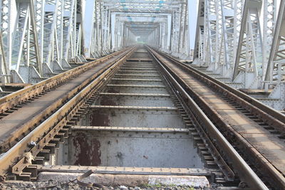 Railway tracks along bridge