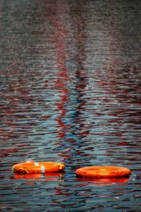 High angle view of life belts on lake