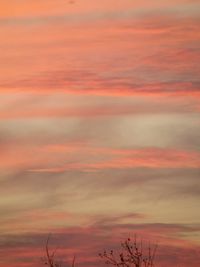 Low angle view of cloudy sky at sunset