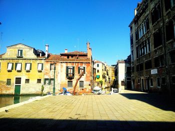 View of buildings against blue sky