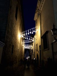 Low angle view of illuminated buildings at night