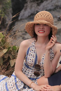 Portrait of a young woman wearing hat