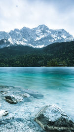 Scenic view of snowcapped mountains against sky