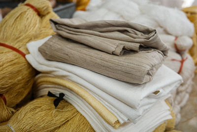 Close-up of towels on bed