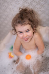 Portrait of cute boy in bathroom