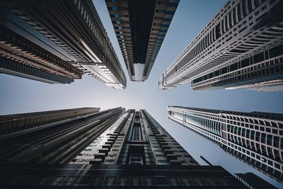 Low angle view of modern buildings against sky in city