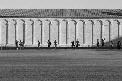 People outside building on street 