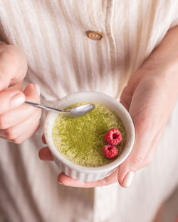 High angle view of person holding bowl