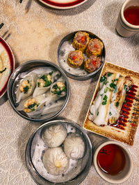 High angle view of dim sum food served on table