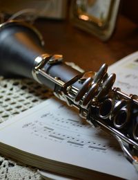 Close-up of instrument on sheet music